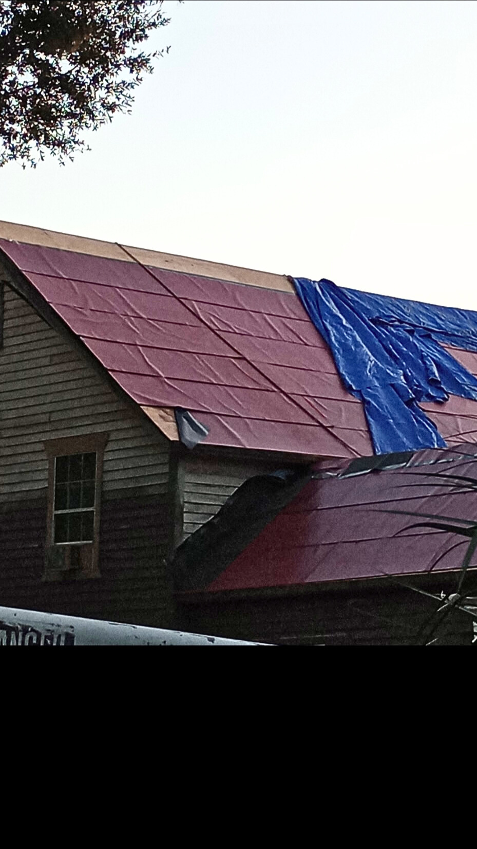 Condition of the tarps after work crew quit the project resulting in interior water damage