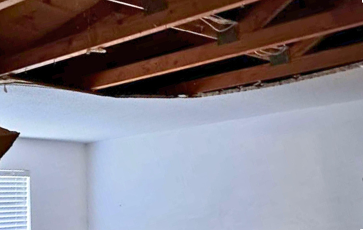 Photographic documentation of interior damage beneath roof area during the period in question (provided by complainant).