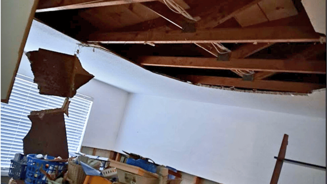 Photographic documentation of interior damage beneath roof area during the period in question (provided by complainant).